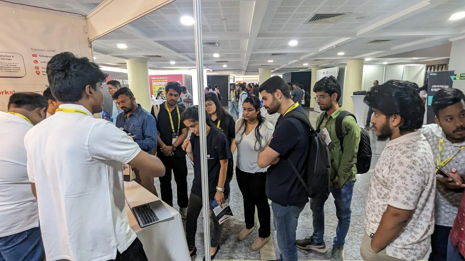 Visitors gathered around the Datachecks booth at Open Source India 2023
